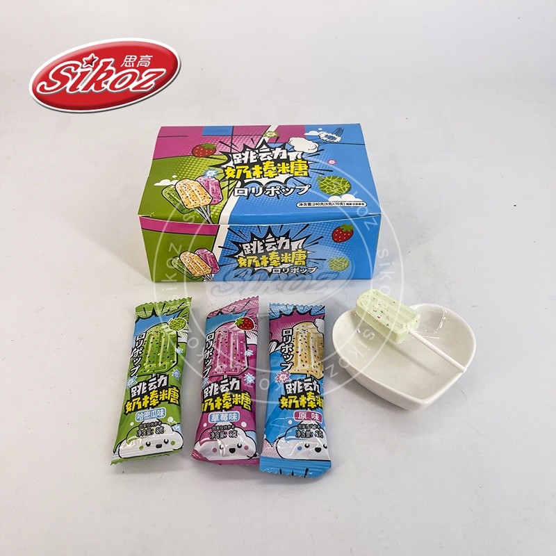 MILK LOLLIPOP WITH POPPING CANDY