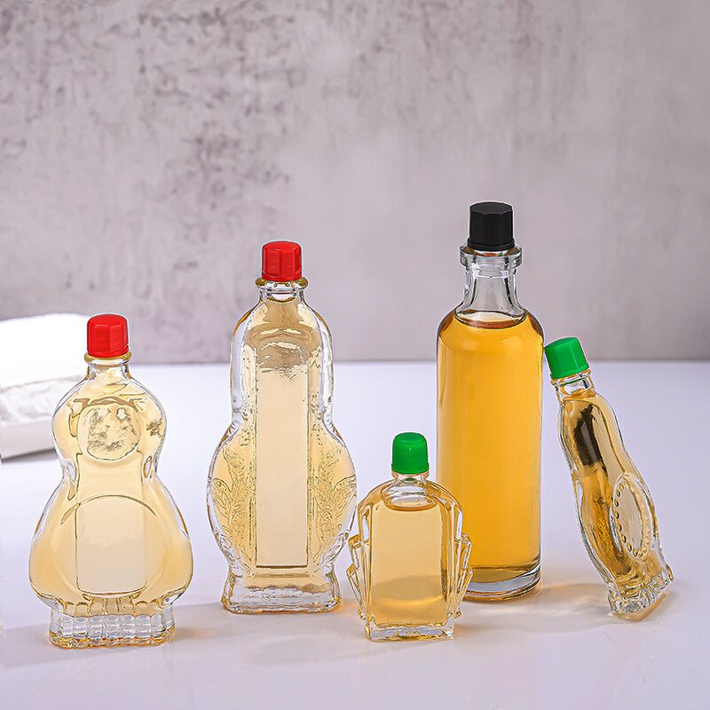 Clear Glass Wind Medicated Oil Bottle Manufacturer - OEM Wholesale Small Red Cap Empty