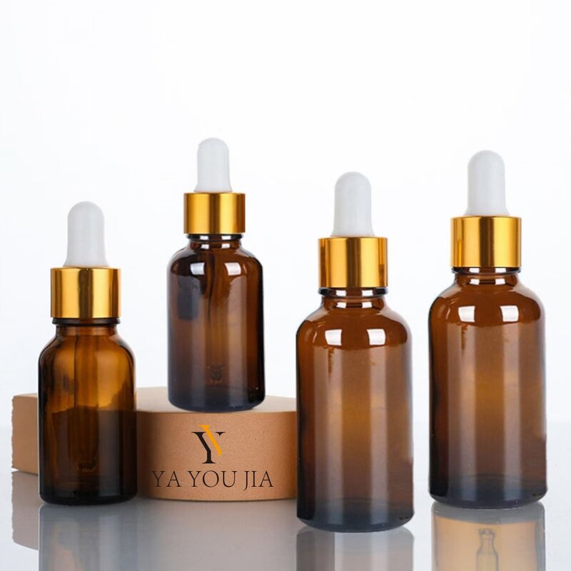 Glass Dropper Bottle Manufacturer - In Stock 30ml 50ml 100ml Transparent Amber Glass Essential Oil with Gold and Silver