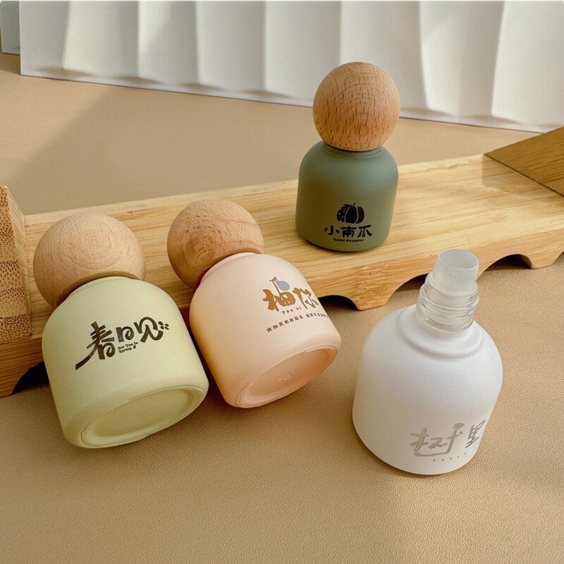 Essential Oil Bottle Manufacturer - Luxury Bamboo Lid Glass Body 10ml Round Roll-On for Face Cream Custom Color Screen
