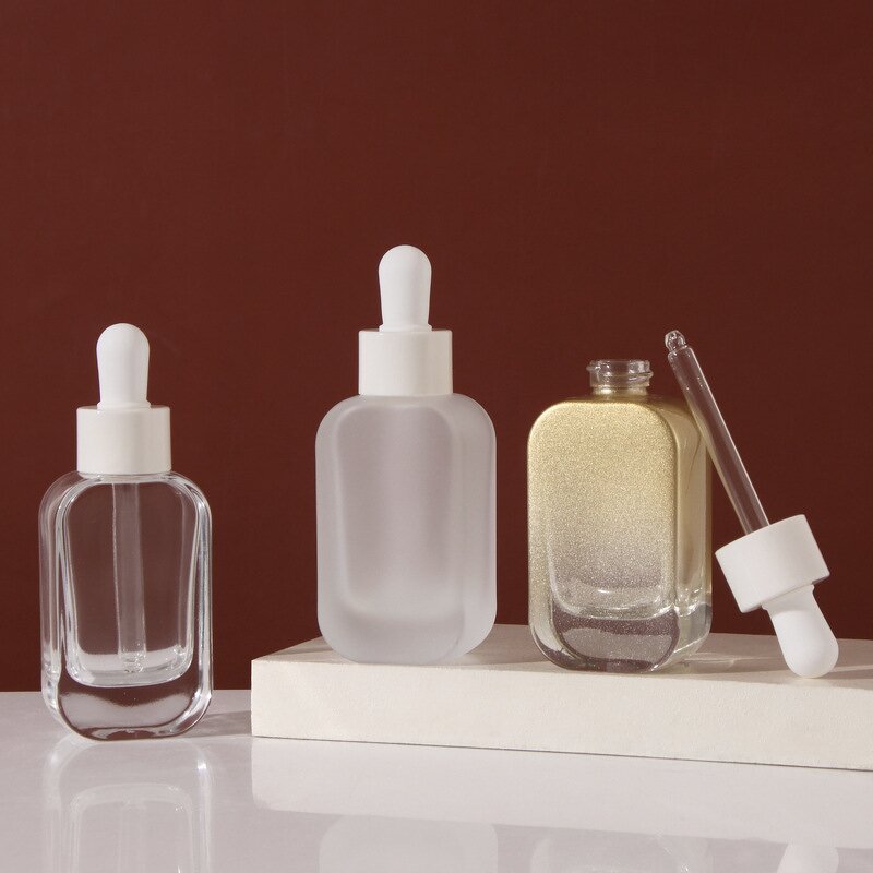 Glass Serum Dropper Bottle Manufacturer - 30ml Frosted Flat Shoulder for Face Cream with a Durable Dropper Packed in