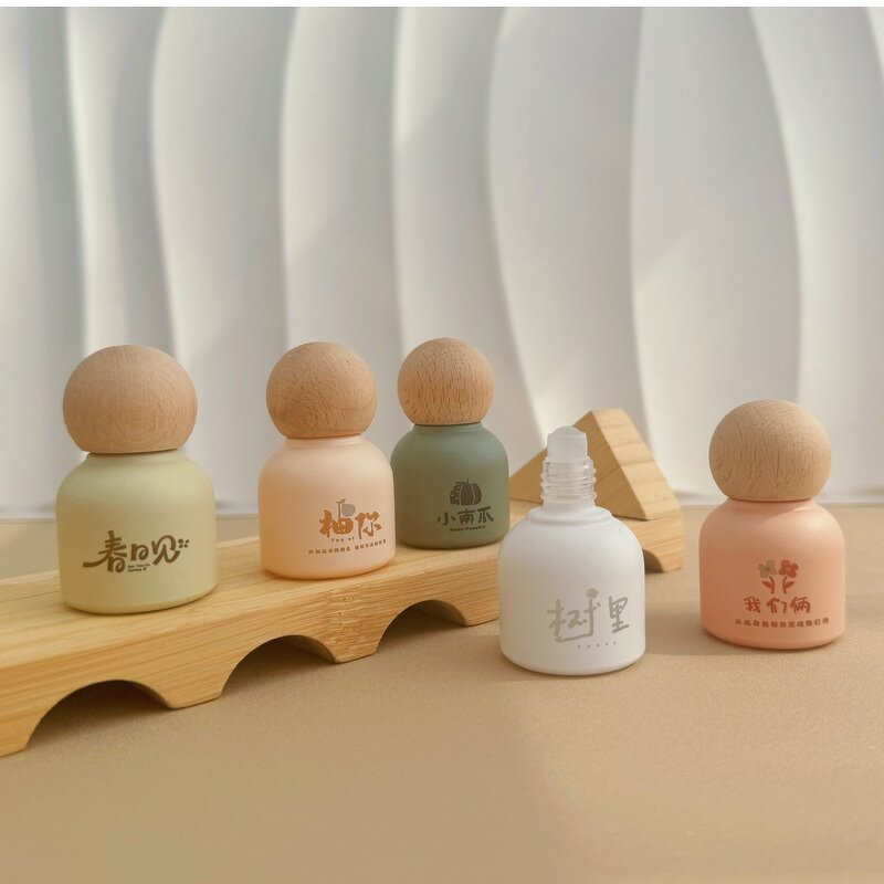 Essential Oil Bottle Manufacturer - Luxury Bamboo Lid Glass Body 10ml Round Roll-On for Face Cream Custom Color Screen