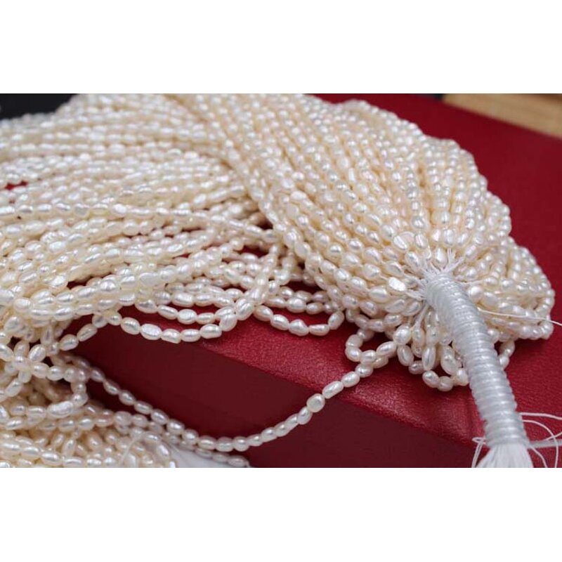 Pearl Necklace - Manufacturer 4-10MM White Nucleated Baroque Freshwater