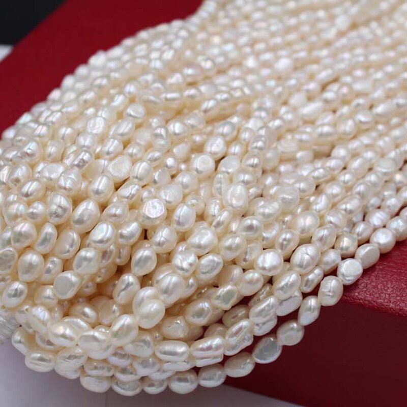 Pearl Necklace - Manufacturer 4-10MM White Nucleated Baroque Freshwater