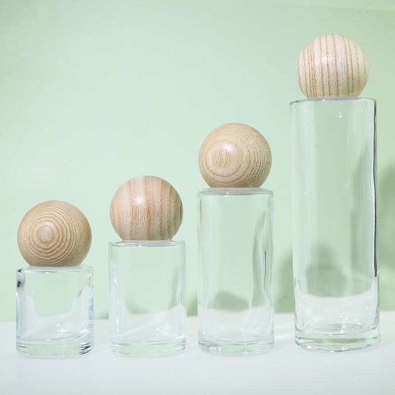 Essential Oil Bottle Supplier - 50ml Round Wood Cover Glass Perfume Oil Bottle with Plug
