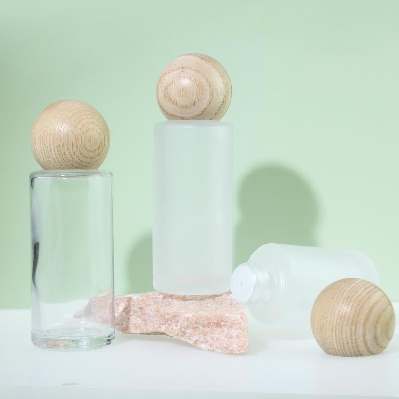 Essential Oil Bottle Supplier - 50ml Round Wood Cover Glass Perfume Oil Bottle with Plug